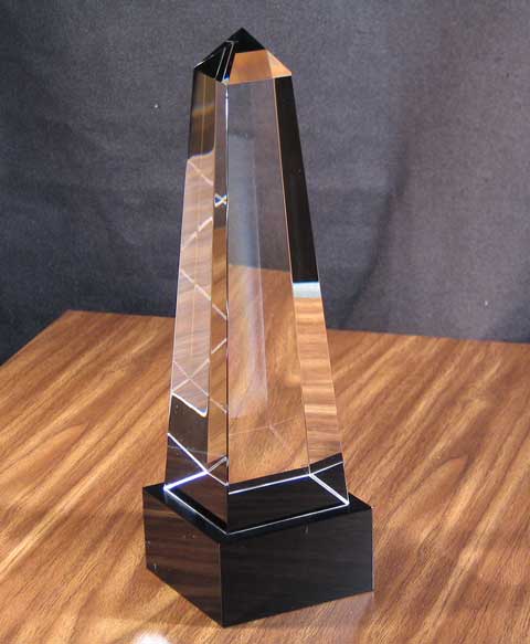 Image of a optical crystal obelisk with a black base