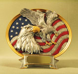 This is a colorful oval resin tray featuring one eagle standing guard with another eagle in majestic flight