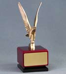 Image of a cast metal modern style  eagle on a red square cube base