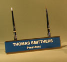 Image of metal desk nameplate holder with two pens