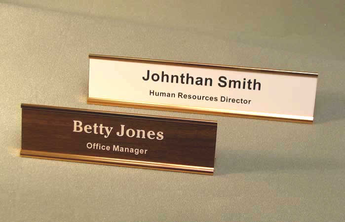 Image of two desk metal nameplate holders with engraved plastic inserts