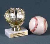 This is a image of a gold colored baseball glove ball holder set on a whitr marble base