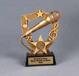 This is a image of a gold color shield shape resin award featuring a microphone 