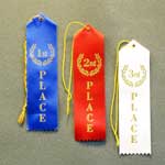 This is a image of a first place,second place, and third place ribbons with strings