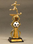 This is a image of a male soccer player standing on soccer riser set on a plastic base