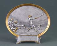 This is a image of a oval silver tray ilistrating a softball game with female players.